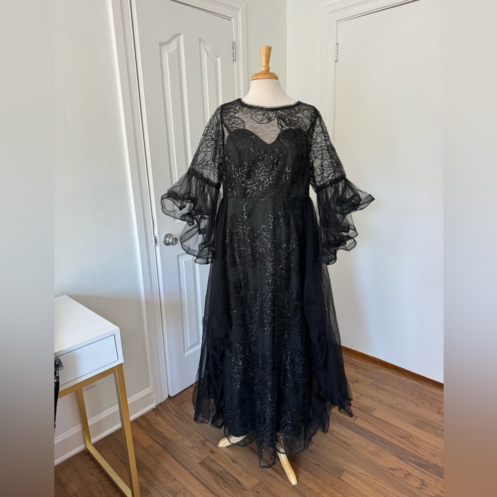 Black witchy plus size gown with unique sleeves and over skirt